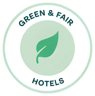 Rundes Green & Fair Hotels Logo mit grünem Blatt-Symbol auf weißem Hintergrund.